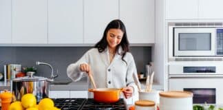 woman cooking inside kitchen room