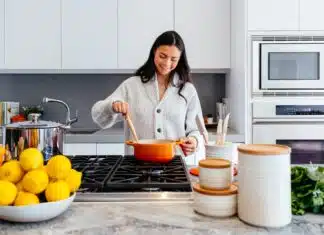 woman cooking inside kitchen room